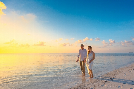 People on beach in nature sky photograph Photo