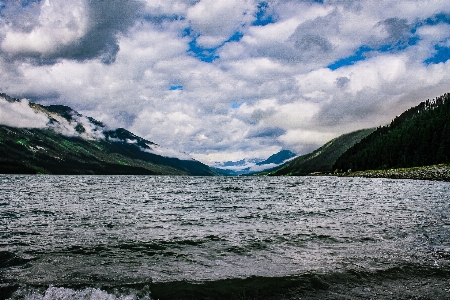 Body of water highland mountainous landforms mountain Photo