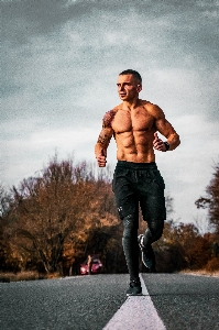 Barechested muscle bodybuilding running Photo