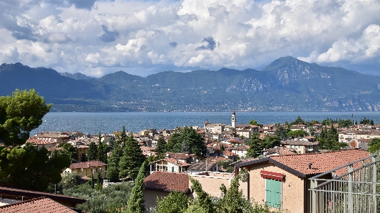 Gardasee torri del benaco sky mountain village Photo