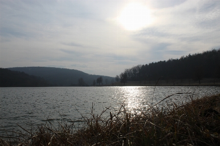 Mountains fishing body of water sky Photo