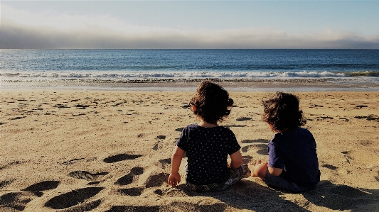 Beach people on sand sea Photo