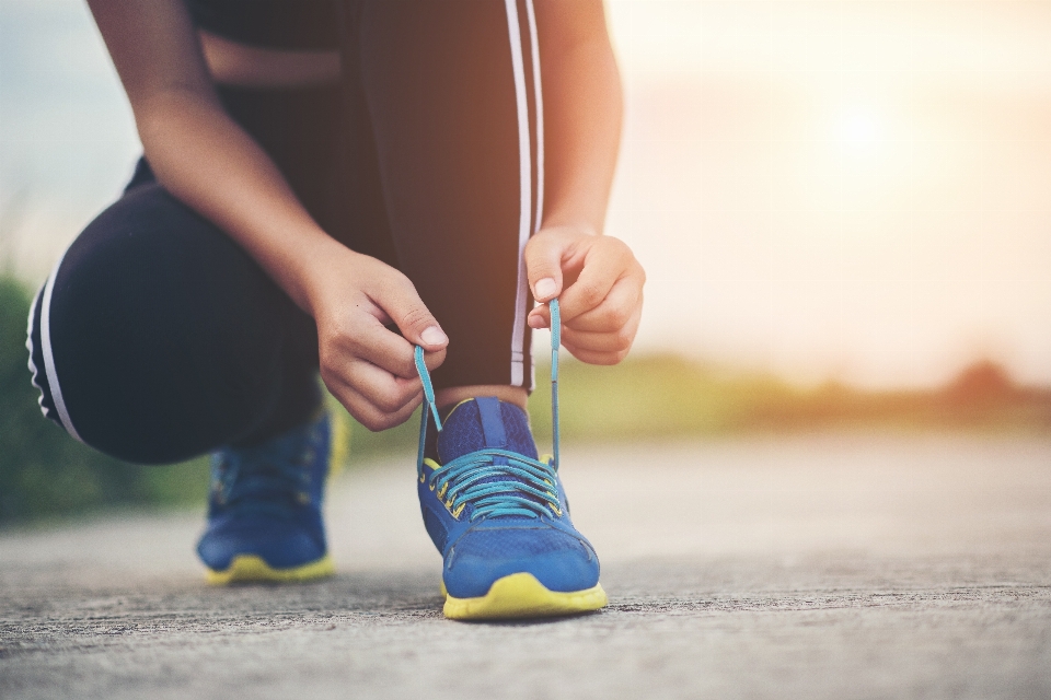 Running shoes tying shoe