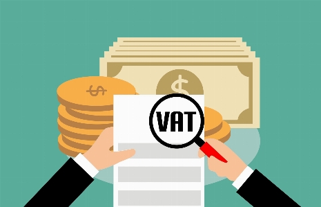 Vat value added tax document magnifying Photo