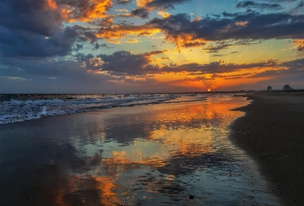 Sunset beach sky body of water Photo