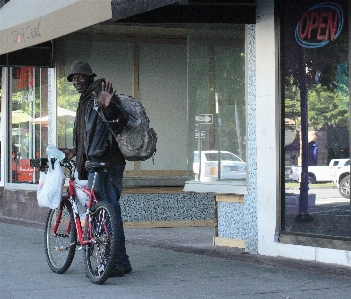 Man bike black waving Photo