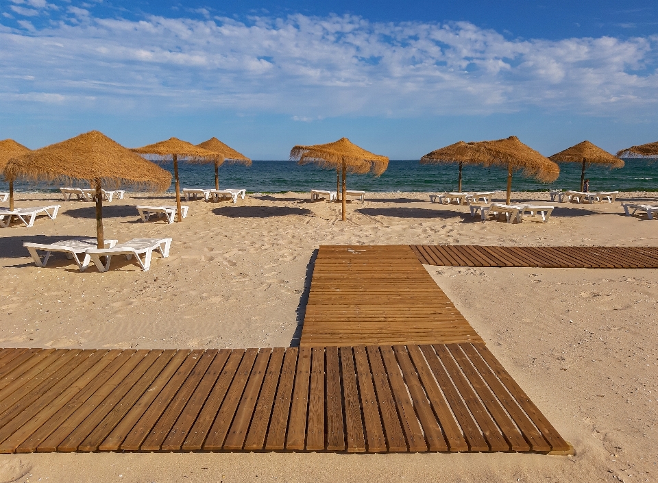 Beach sand sky sunlounger