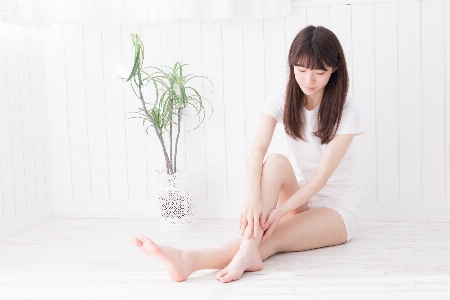 Girl skin leg sitting Photo