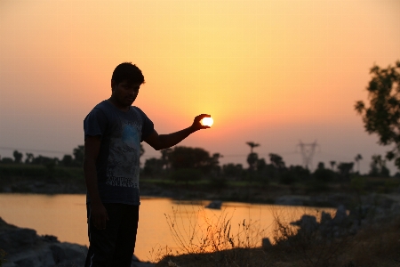 Sunset catching sun people in nature Photo