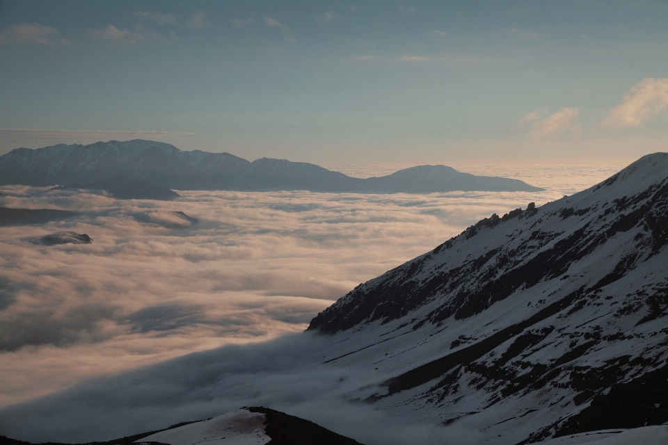 Cliff clouds mountains sea of