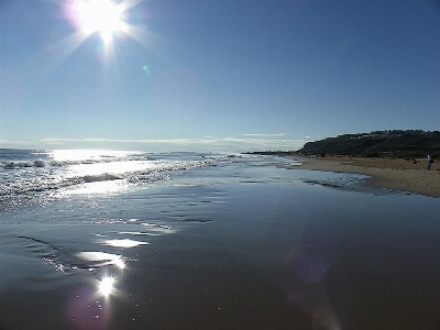 Beach sea sunset body of water Photo