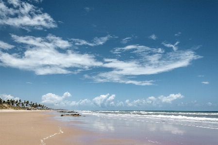 Blue sky beach mirror Photo