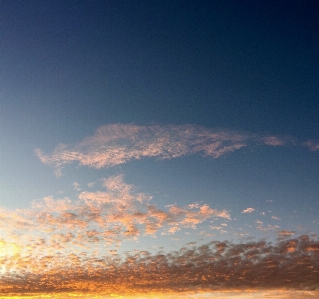 Sky blue pink clouds gold Photo