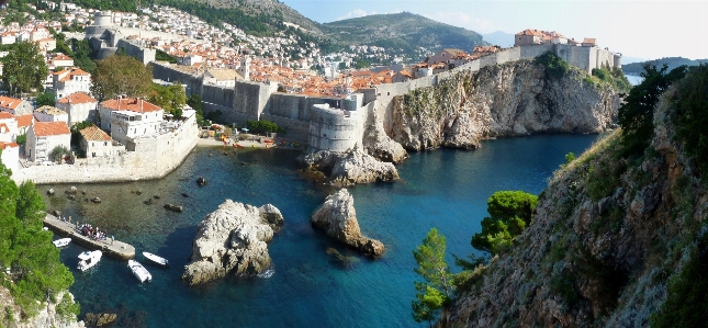 Sea walled city body of water Photo