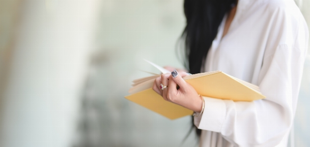 Woman yellow writing instrument accessory Photo