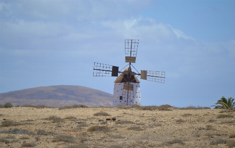 Island windmill land rocks Photo