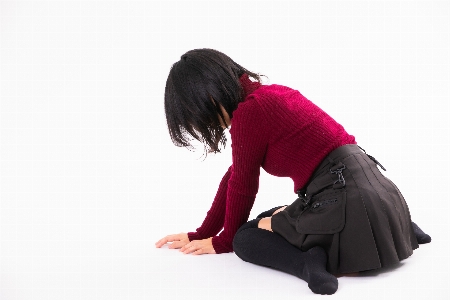 Woman sitting shoulder red Photo