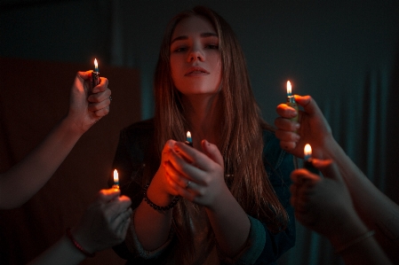 Woman lighting orange light Photo