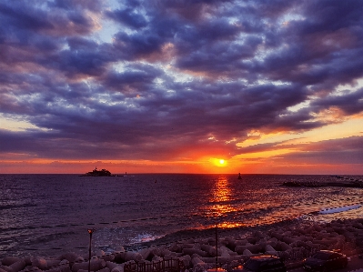 Sunrise sky horizon body of water Photo