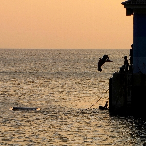 Child young jump sea Photo