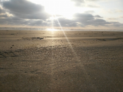 Sand clouds sun sky Photo