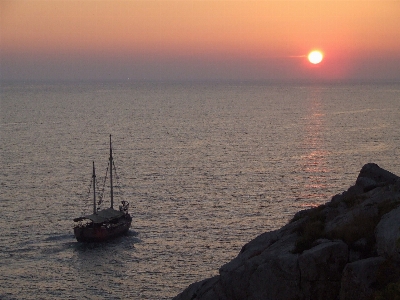 Sunset boat sea beautiful Photo