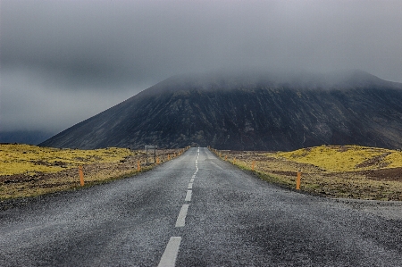 Highland road mountainous landforms sky Photo