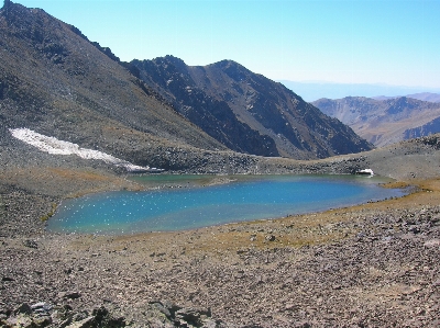 Natural mountainous landforms mountain body of water Photo