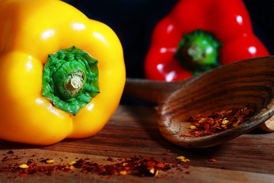 Gastronomy bell pepper spices wooden spoon