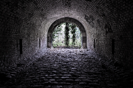 Urban exploration tunnel stones Photo