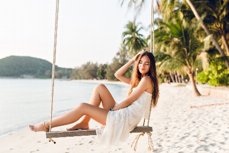 Summer girl beach swing Photo