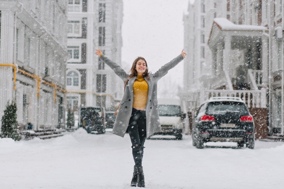 Snowing girl joy having fun