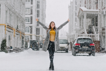 Snowing girl joy having fun Photo