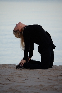 Yoga beach sunset standing Photo