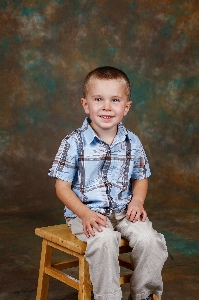 Red face sitting child Photo