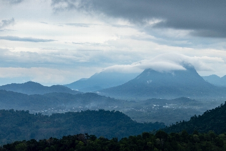 Hill cloudy mountainous landforms sky Photo