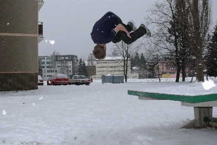 Boy jumping snow shirts Photo