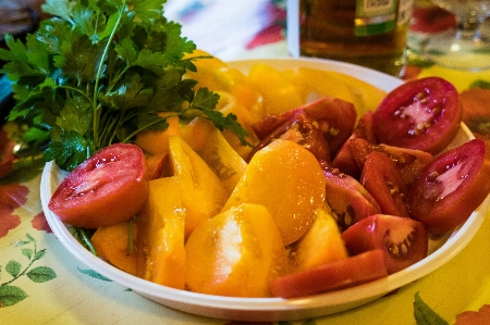 Tomatoes vegetables cut parsley Photo