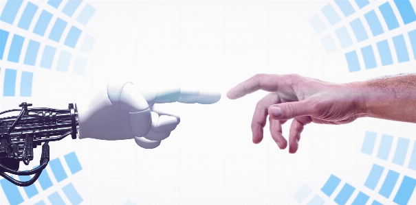 Robot hand human handshake Photo