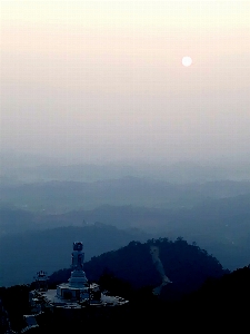 Bodhisattva sculpture mountain sunset Photo