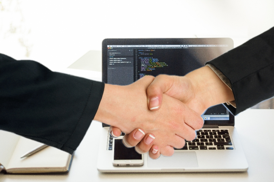 Handshake agreement laptop hands