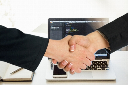 Handshake agreement laptop hands Photo