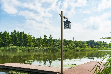 Street lamp sky water Photo