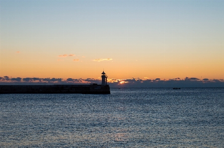 Dawn at sea lighthouse Photo