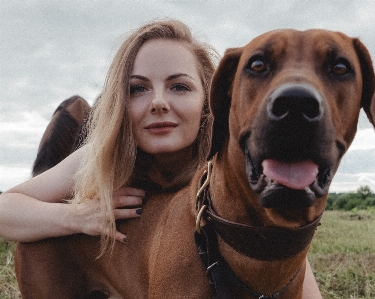 Woman dog cloud smile Photo