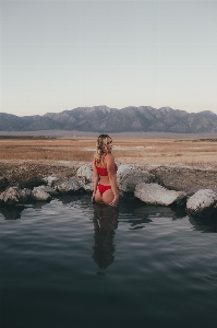 Woman water sky mountain Photo