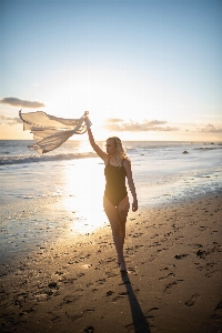 Woman water sky hand Photo