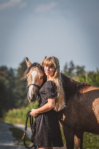 Woman horse sky dress Photo