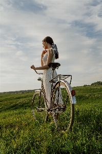 Woman cloud tire bicycle Photo