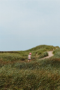 Sky people in nature slope grass Photo